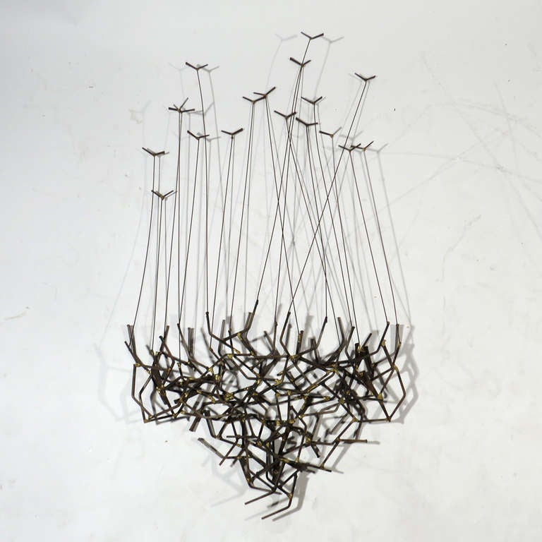 Unusual Mid-Century wall sculpture. A flock of birds in flight on thin rods, with rode rising from a complex network of angled welded iron with brass welds. Terrific accent piece for the shore home.

Good condition. All welds intact. No metal bent