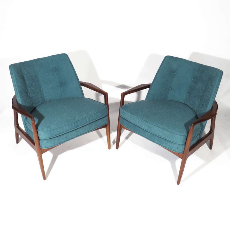 Pair Milo Baughman chairs upholstered in soft tufted teal. Beautiful deep walnut frames with exceptional finger joinery. Designed in 1965. Call for COM or COL pricing.