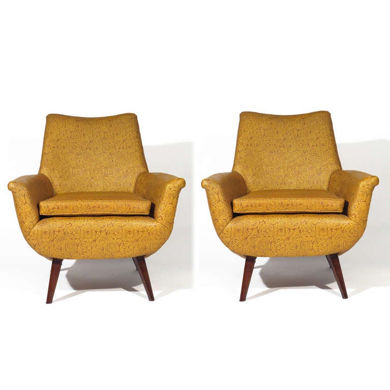 Pair rounded club chairs attributed to Ernst Schwadron. Tapered walnut legs. Priced com, simply send us your material, although current upholstery is one of the most unusual leatherette patterns we have ever seen.
