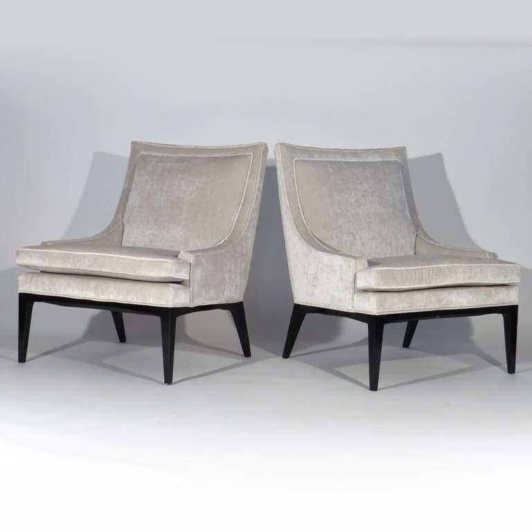 Pair graceful Mid-Century lounge chairs upholstered in Romo Zinc Orbit Moonbeam silk velvet. Black lacquered frames.