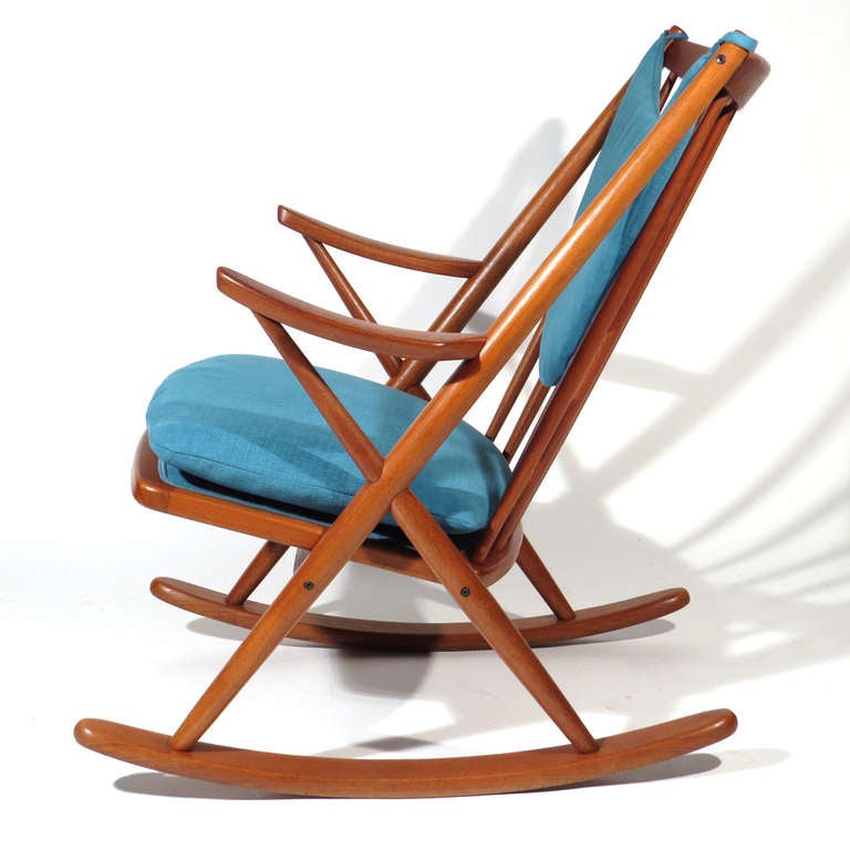 Frank Reenskaug for Bramin Danish teak rocking chair upholstered in Romo Linera Kingfisher. Immaculate restored condition. Very comfortable. Bramin label affixed to underside.
