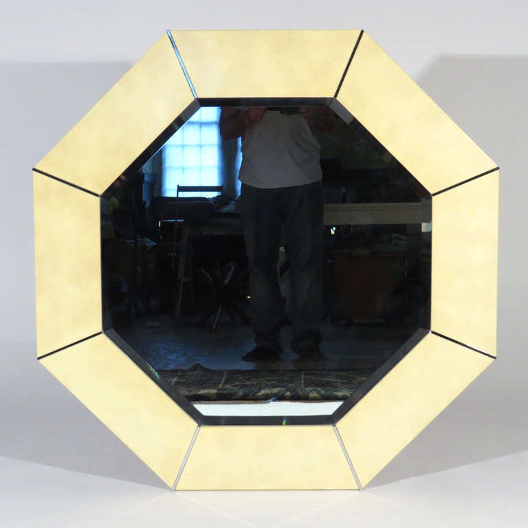 Octagonal form Karl Springer beveled mirror. Marbelized lacquered frame with chrome joints.