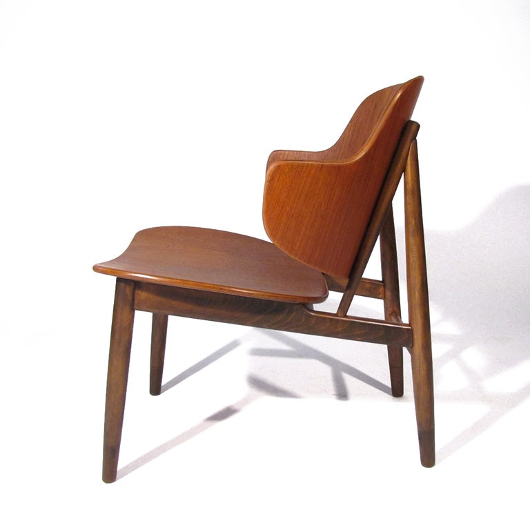 Ib Kofod-Larsen for Christiansen & Larsen A/S, shell chair crafted in teak and with oak frame. Quite a comfortable accent chair with generous seat and wide curved back.

Immaculate restored condition.