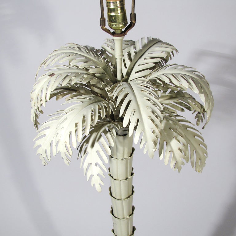 Decorative floor lamp with superb detail, note its many leaves and jointed stem. Original heavy finial. Currently appealing in coated ivory over metal, but we will have professionally re-coated any color upon request. The table lamp version were