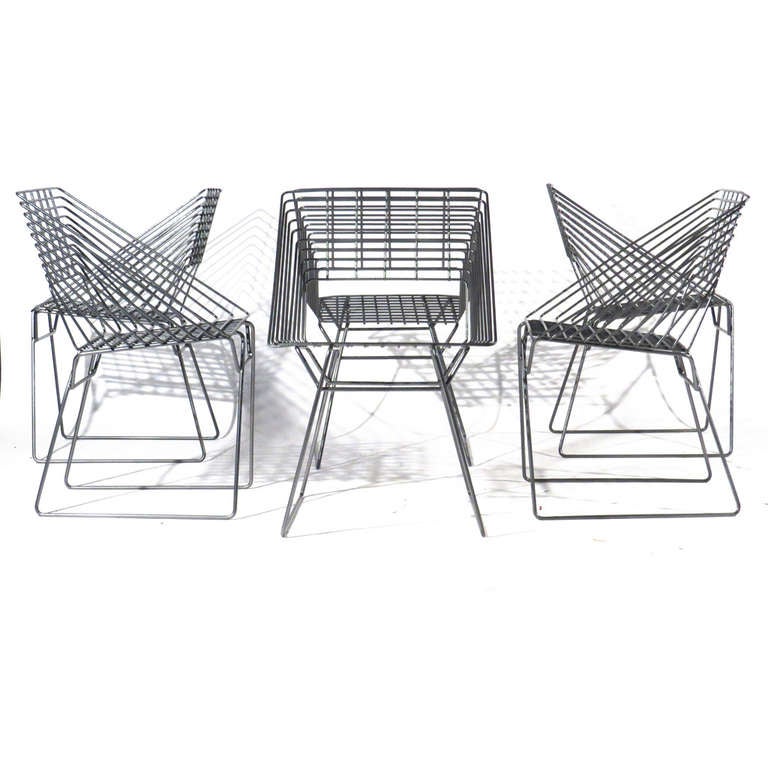 Six wire grid form heavy welded steel chairs produced by Fritz Hansen, attributed to Verner Panton. Newly powder coated in graphite. Excellent architectural form.