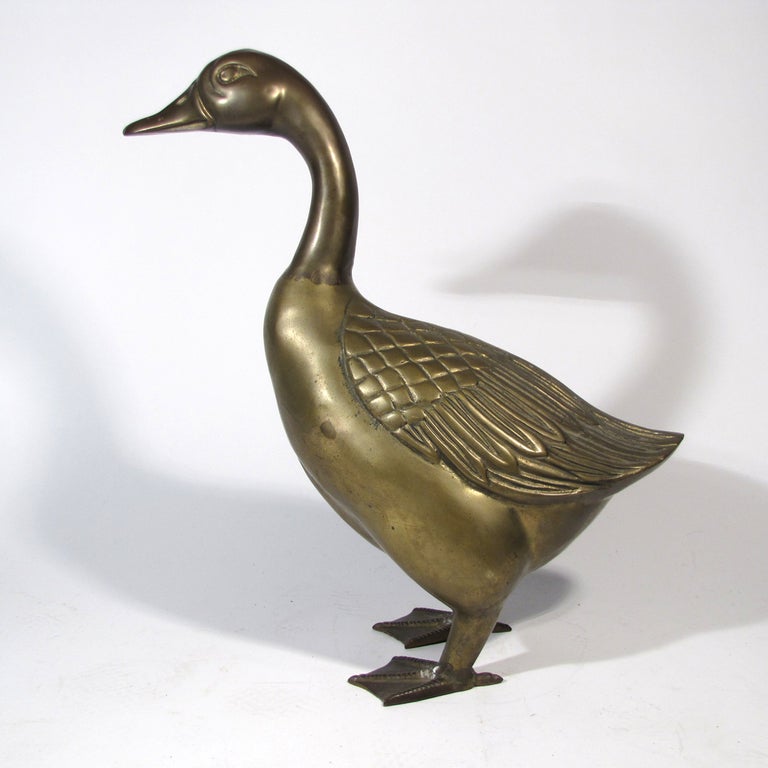 Quite large solid brass goose in nice pose. We can have the goose plated copper or chrome, or highly polished and lacquered, but she looks lovely as is.

Overall excellent condition. Please call Eddy at 410.299.9147 for detailed condition report,