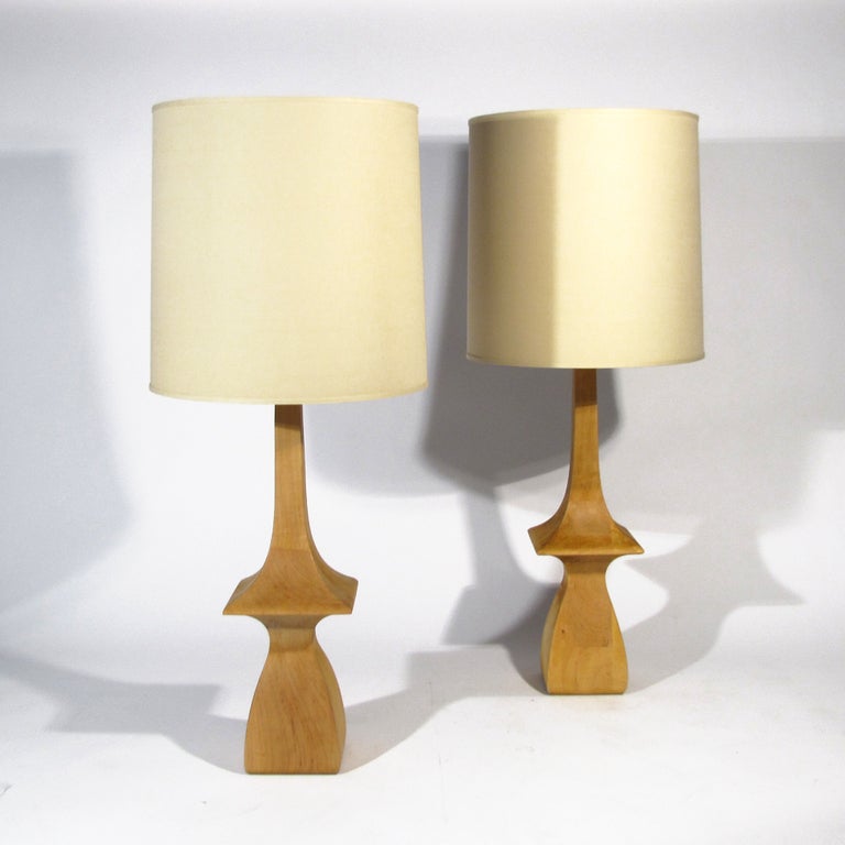 Rare pair of monumental Frederick Cooper table lamps turned in solid maple. Although beautiful in their current state, this pair comes with a finishing option. At this point we can apply a stain color or lacquered piano finish in any color, and this