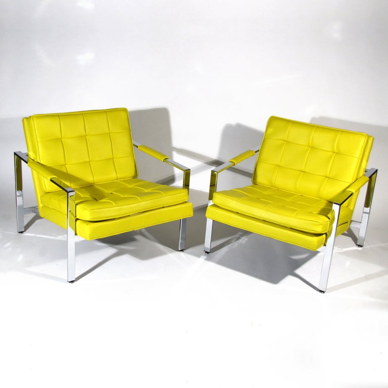 Striking pair Milo Baughman for Thayer Coggin flat bar chrome club chairs upholstered in bold canary leatherette. Baughman / Coggin labels affixed under cushions. Very comfortable with angled seat and back.

Chrome and leatherette perfect.