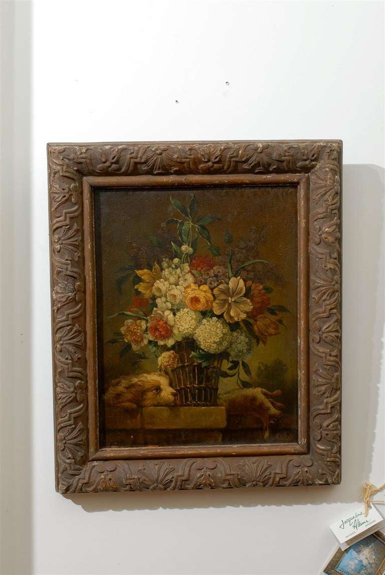 A French framed Louis XV style oil on panel still-life floral painting from the late 19th century, with dog and rabbit motifs. Born in the third quarter of the 19th century, this French painting features a theme particularly popular in Europe since