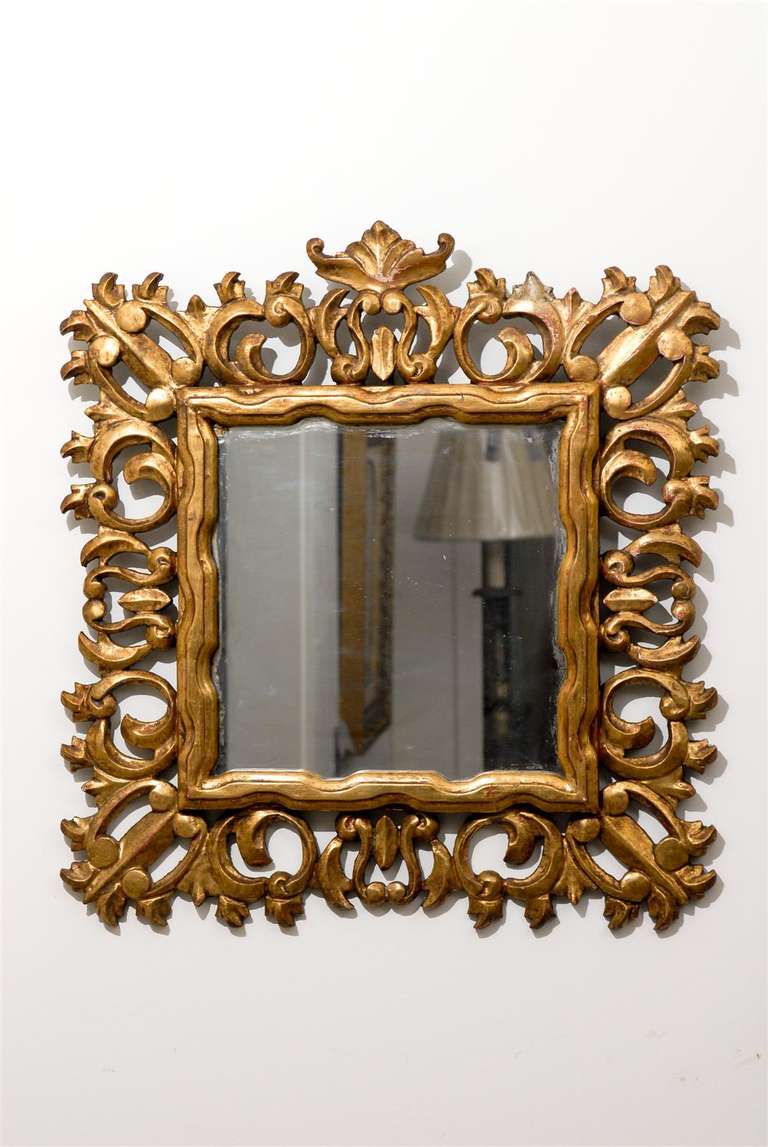 20th century hand carved Florentine giltwood framed mirror.