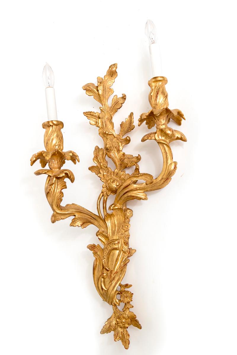 Pair of Louis XV style gilt, two-light sconces, hand carved and electrified. Sold as a Pair
Price reflects price for Pair.