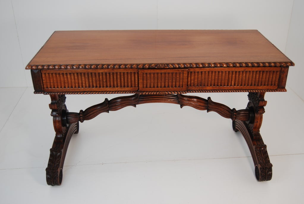 Unusual Anglo Indian padauk wood writing table.