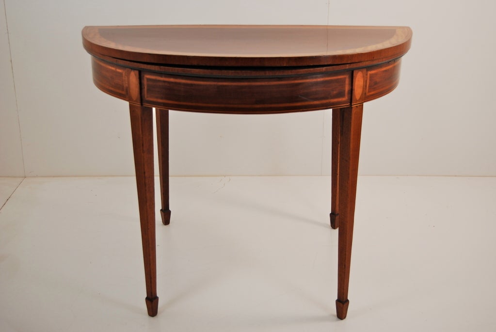 Attractive George III line and shell inlaid mahogany games table crossbanded in satinwood.