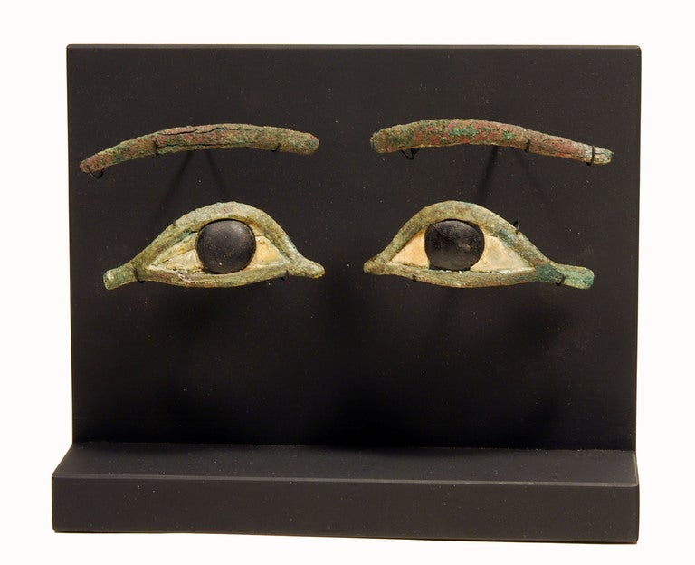 Cast frames of these almond shaped eyes in bronze with extended cosmetic lines, inlaid with calcite and obsidian. Brows separate in cast bronze.



(4) pieces with lashed.



French Private Collection initials C.A.B collected ca 1940.