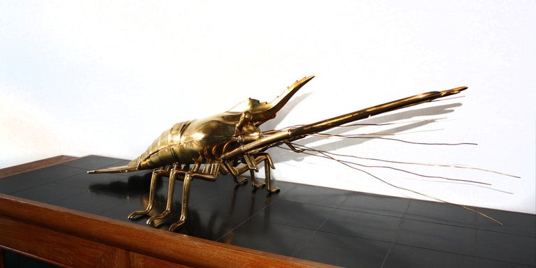 big and massive lobster made of brass