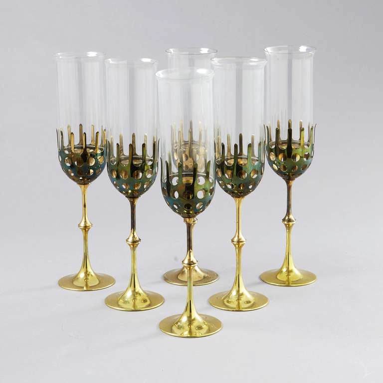 Set of 6 big Hurricane candleholder, brass with clear glass.
Design : Bjørn Wiinblad.

45 cm each / 17,8 inch

Bjørn Wiinblad, internationally high
profiled artist, is considered one of the
most colourful and versatile artists of