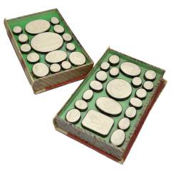 Collection of Plaster Medallions Mounted in Faux Books