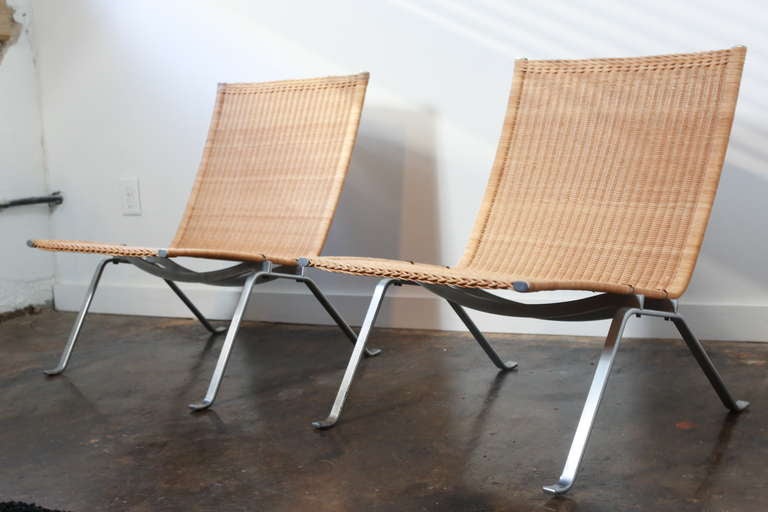 A beautiful pair of Scandinavian mid-century modernism of Poul Kjaerholm's majestic minimalist and refined lounge chair.  Signed with impressed manufacturer's mark to underside of each example: [Denmark].

Literature: The Furniture of Poul
