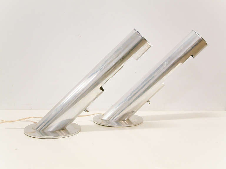 A stunning and rare pair of tubular aluminum desk / table top lamps by Paul Mayen believed to be prototypes for Habitat Inc.  The lamps are in very good condition with only slight oxidation on the inside bulb reflector where the Habitat Inc, New