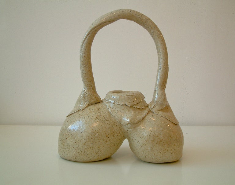 A sculptural vessel inspired by the female form by nationally recognized potter Nancy Jurs of Rochester New York.  She was a professor at Columbia University, State University of New York and the Rochester Institute of Technology.  Nancy Jurs is a