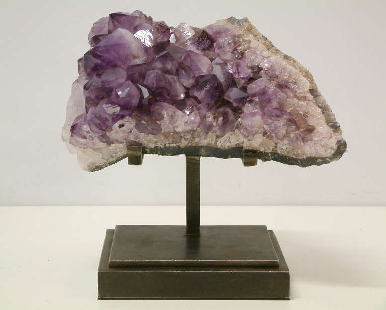 A large and beautiful amethyst crystal from Brazil mounted on a custom steel oxidized base designed and fabricated by Maurice Beane Studios.

Measurements:
9.5