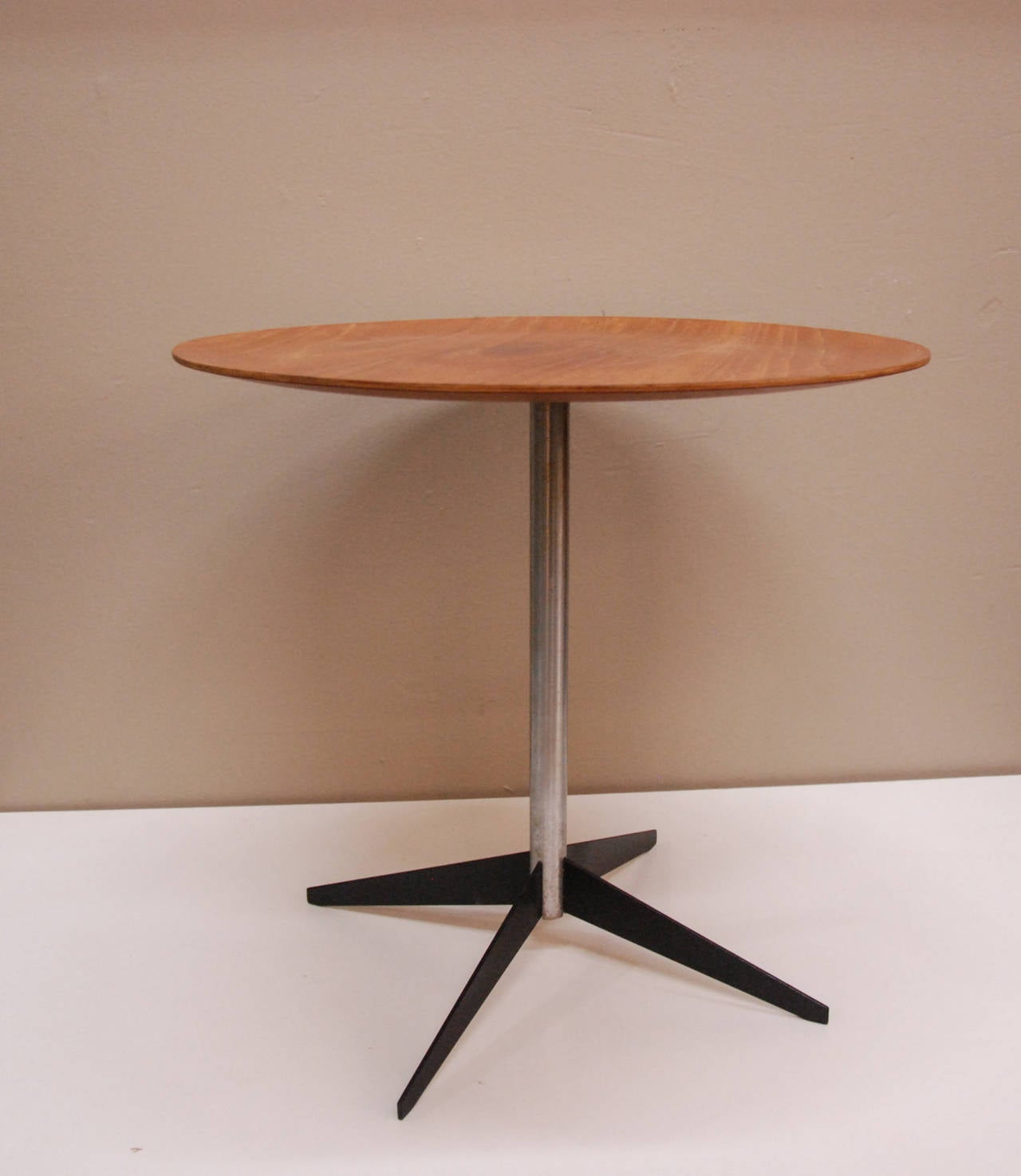 A rare George Nelson Associates walnut ply,  polished and enameled steel tray table for Herman Miller Furniture Company.