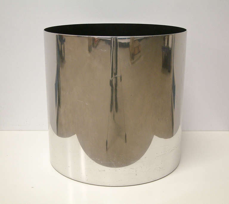 A large polished aluminum planter with a black polychromed liner designed by Paul Mayen for Architectural Supplements.  The planter has the manufacturer's round foil label on the bottom and was acquired from Paul Mayen's estate in 2012.