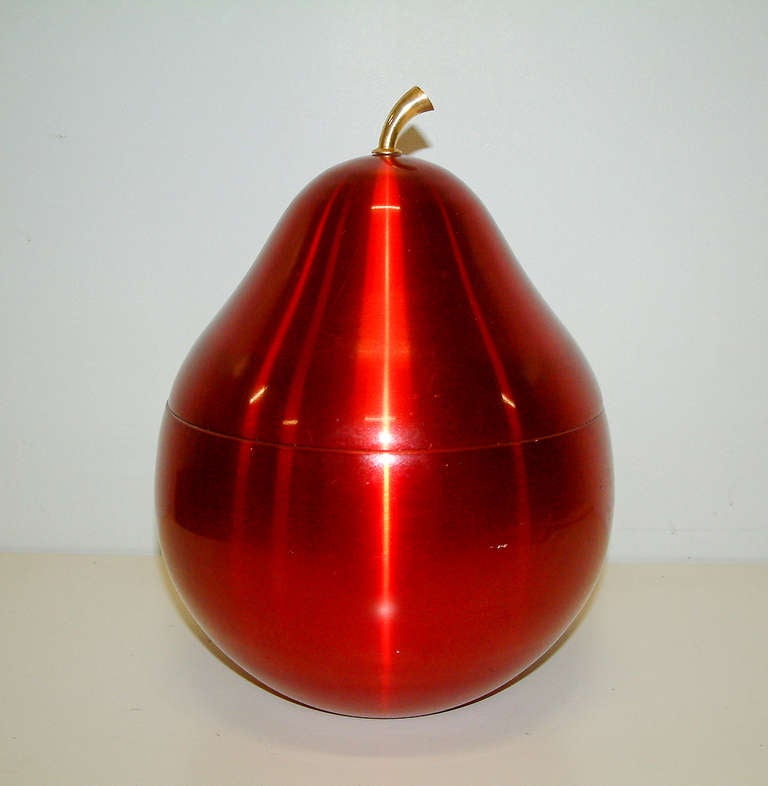 A stunning 1960's Daydream Production red anodized aluminum pear ice bucket with a cast bronze stem.  The piece is signed on the base measuring 10.88