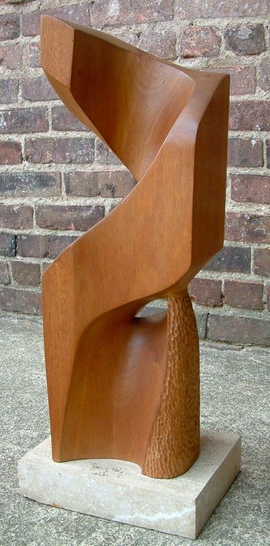 Carved mahogany sculpture on a travertine base by accomplished Richmond, Virginia artist Shirl Tandlich.  Tandlich studied under noted French born sculptor Robert Laurent.