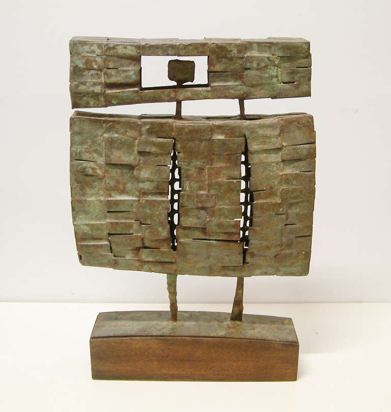 A striking bronze and steel sculpture mounted on a walnut base by noted sculptor Paul Miller Kline.  Kline was born in Geer, Virginia on August 6, 1931 and later received his Bachelor of Arts Degree in music from Bridgewater College in 1951 and his