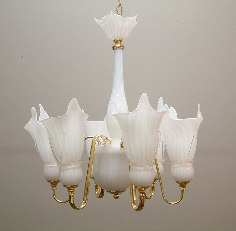 A beautiful white Murano glass and goldtone metal chandelier handblown in Italy in the 1980s. All original components.