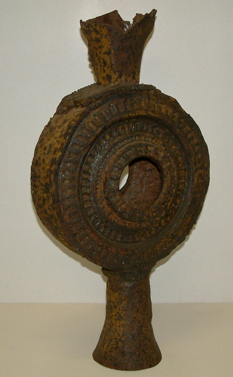 A monumental Jack Hooker slab built stoneware vase with a matte glaze.  This sculptural vase was used in a Schumacher wall paper advertisement and is signed and dated on the side of the base.