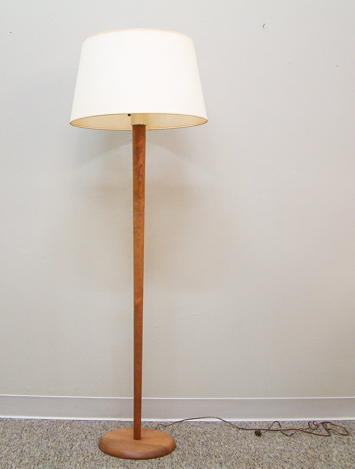 A finely executed floor lamp with a single socket, glass diffuser insert and original fabric shade.  For an almost identical model reference:  Sollo Rago - April 22-23, 2006, lot 1542.

Shade measurement:  20