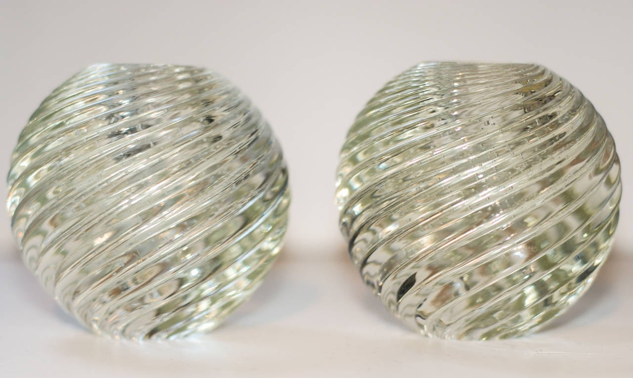 A striking pair of Murano glass candleholders handblown with a swirled glass and controlled bubble technique much like examples by Venini in the 1940s.  Superior craftsmanship.