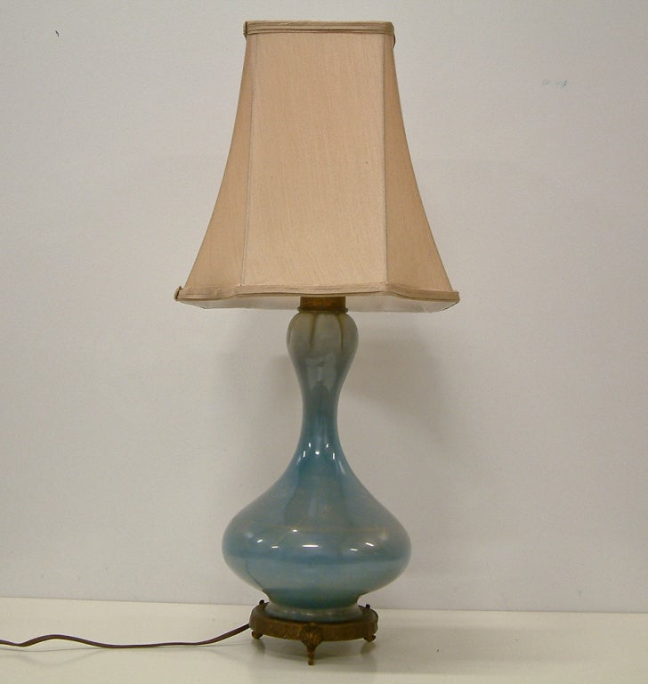 A rare sky blue lamp with gold inclusions by Maestro Archimede Seguso.  This lamp is remarkable for the sublety and technical finesse of the gold leaf overlay and is complete with the original brass mounts, fittings and Seguso Murano foil label.  A