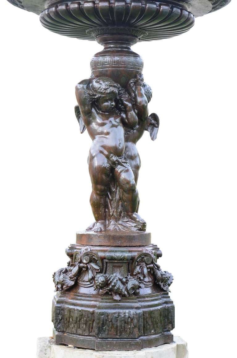 Rare cast iron fountain center piece dated late 19th century. 
Origin : Town house in Compiègne. Little old accidents - Minor restorations. Stone pedestal: 23 in. H. x 37 in. W. x 37 in. 
D. DURENNE Foundry.