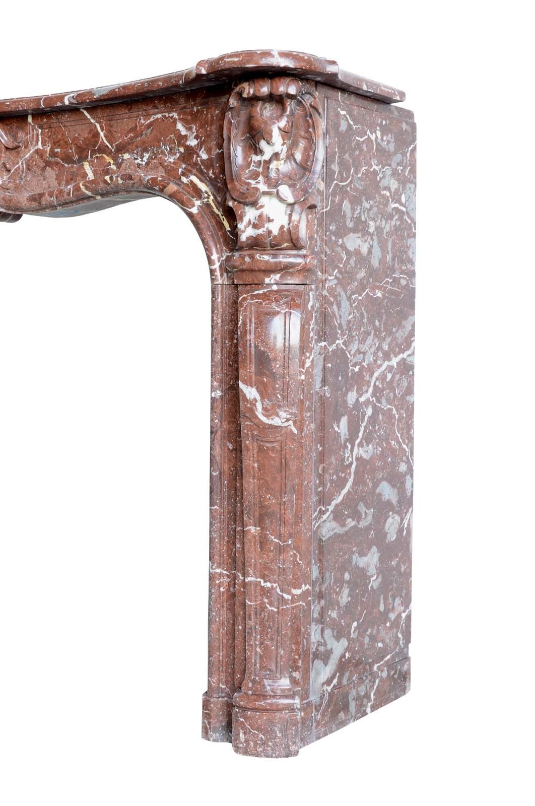 French Louis XV period red marble fireplace dated 18th century. Restored. Origin: Burgundy, Town house in Dijon. Opening: 36 x 50 in.