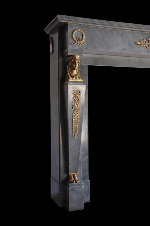 French Empire period marble and gilded bronze fireplace