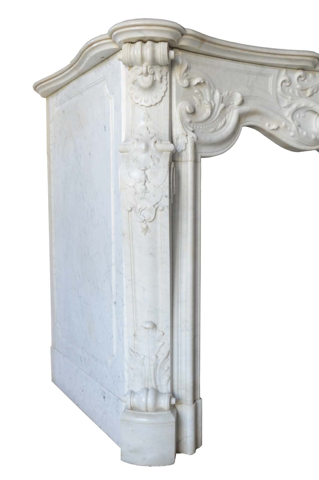 Rare French Louis XV style white marble fireplace dated 19th century. Opening measures: 35 x 42 in.