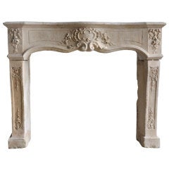 French Louis XV period limestone fireplace