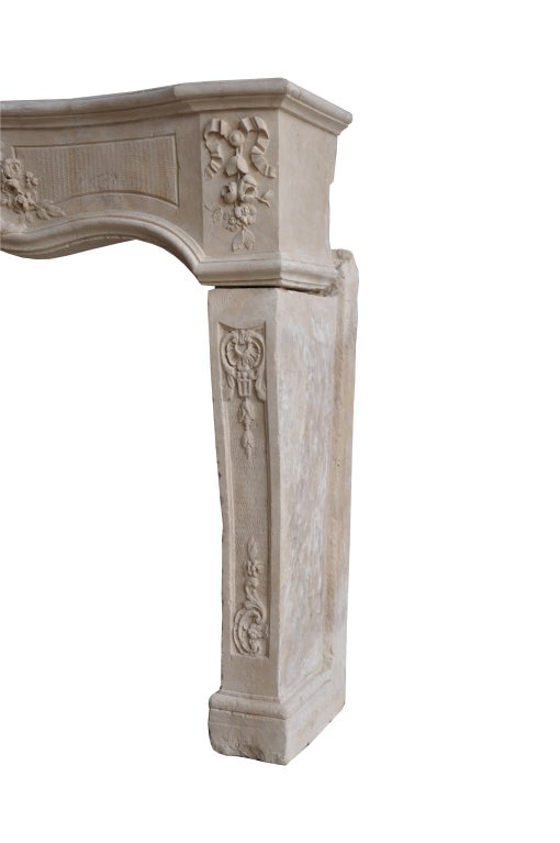 French Louis XV period limestone fireplace