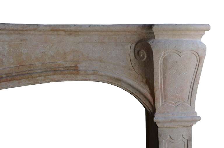 A French Louis XV Period Limestone Fireplace, 18th Century 1