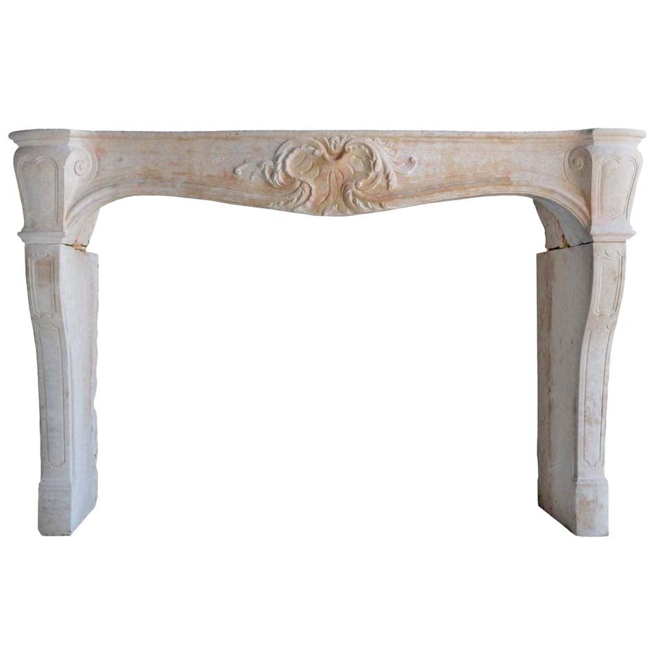 A French Louis XV Period Limestone Fireplace, 18th Century