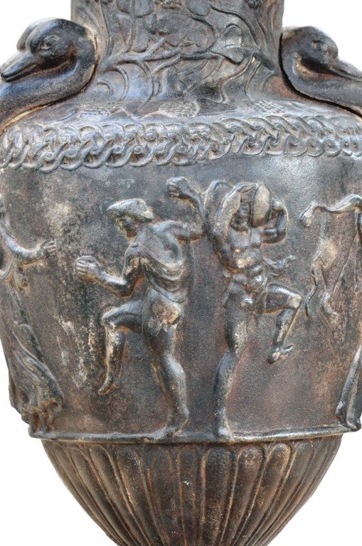 Rare cast iron vase after the Sosibios of Atena vase kept in the Louvre Museum. Late 19th century Probably Barbezat & Cie Foundry. circa 1860. Base: 10 in.