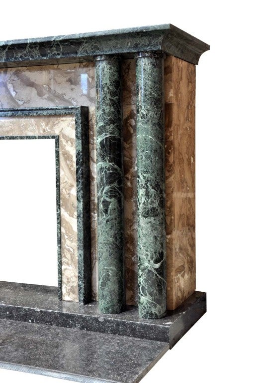 After a model from Jacques Emile Ruhlmann (1879- 1933).
A French Art Déco marble fireplace, with four ornamental columns supporting the shelf. Marble named Vert Maurin, and Byzantin. Ca 1929. Origin : Bourgeois mansion in Saint Julien en Genevois,