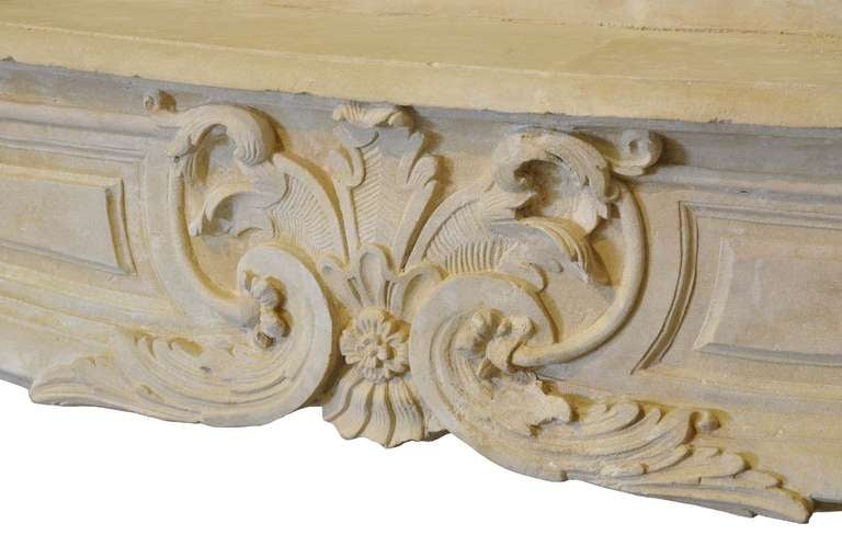 French Louis the 14th period richly carved limestone fireplace