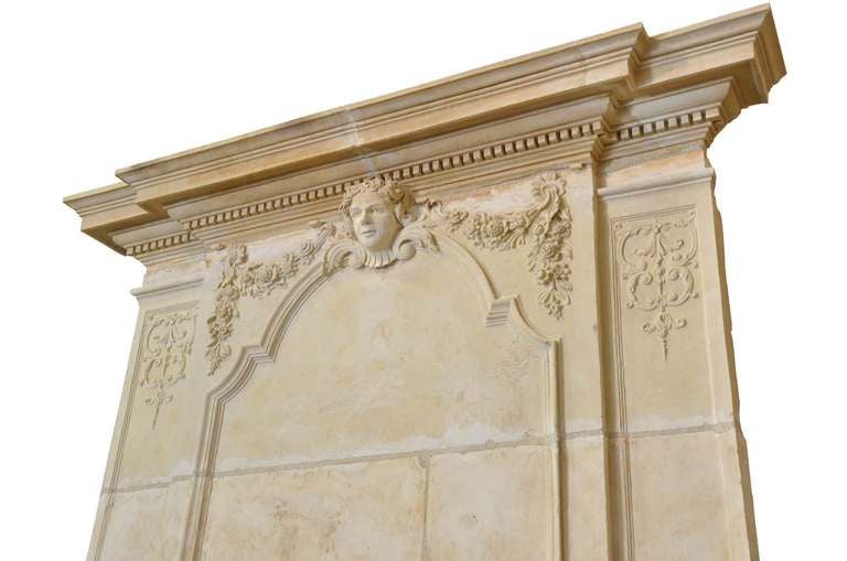 Limestone Louis the 14th period richly carved limestone fireplace