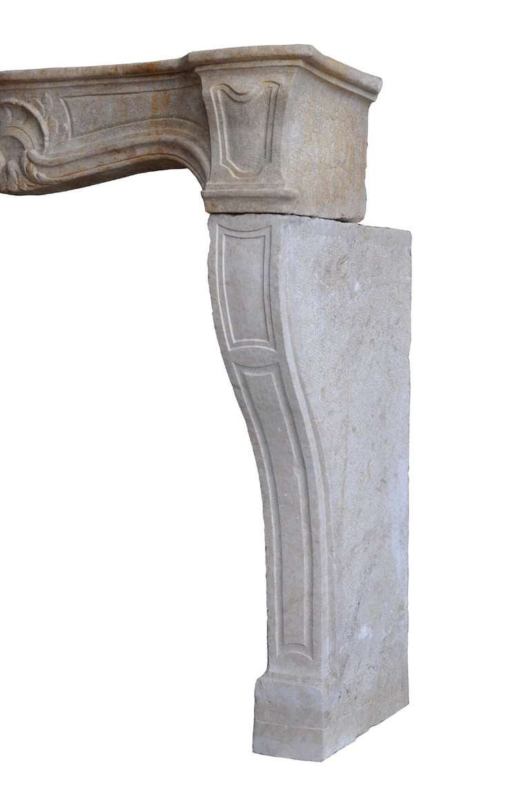 A French Louis the 15th limestone fireplace dated middle 18th century. Opening : 34 in. H. - 26 in. W. # C3293.