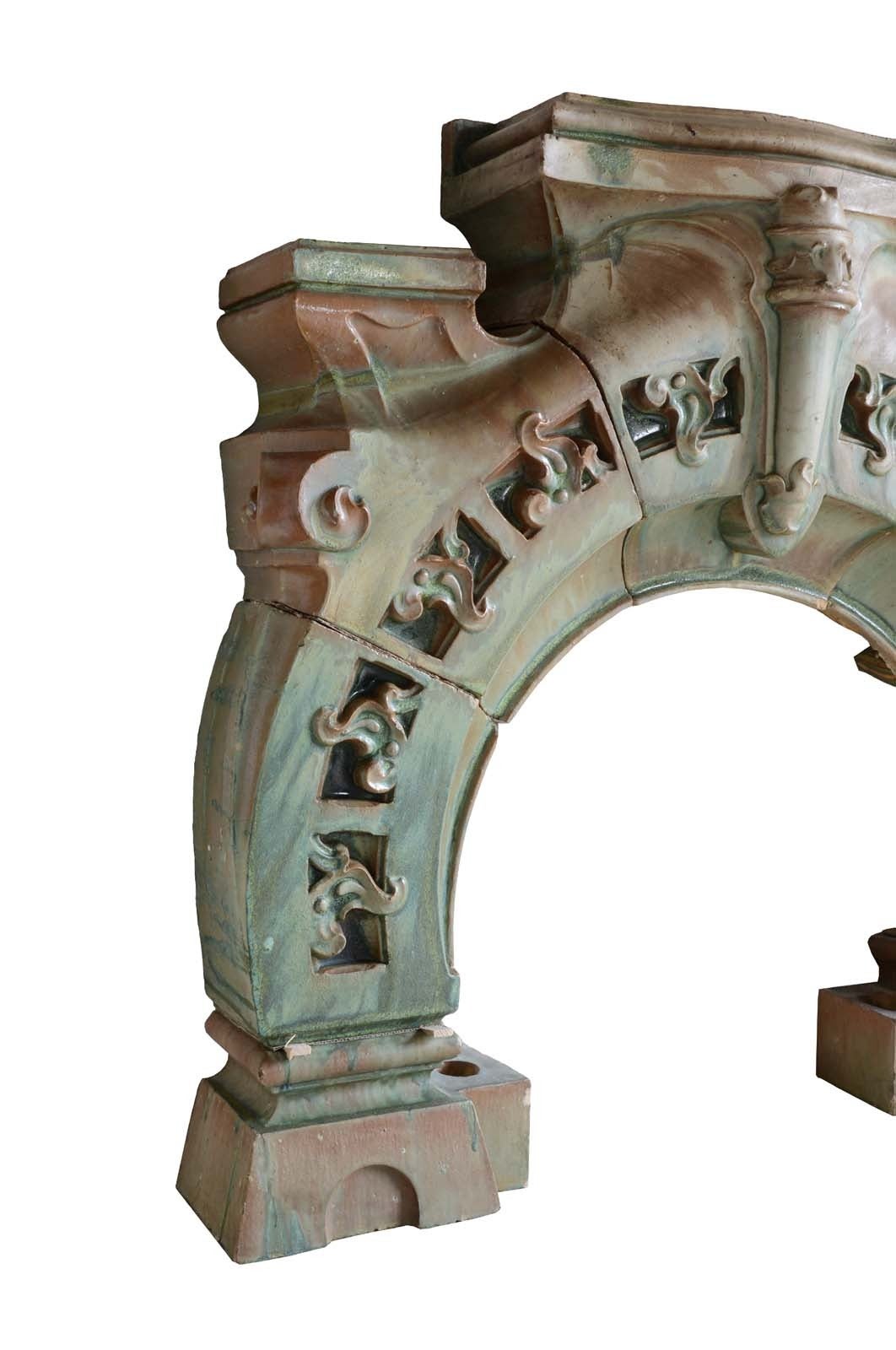 French Art Nouveau period green glazed ceramic fireplace dated late 19th century. Opening size: 32 x 34 in.