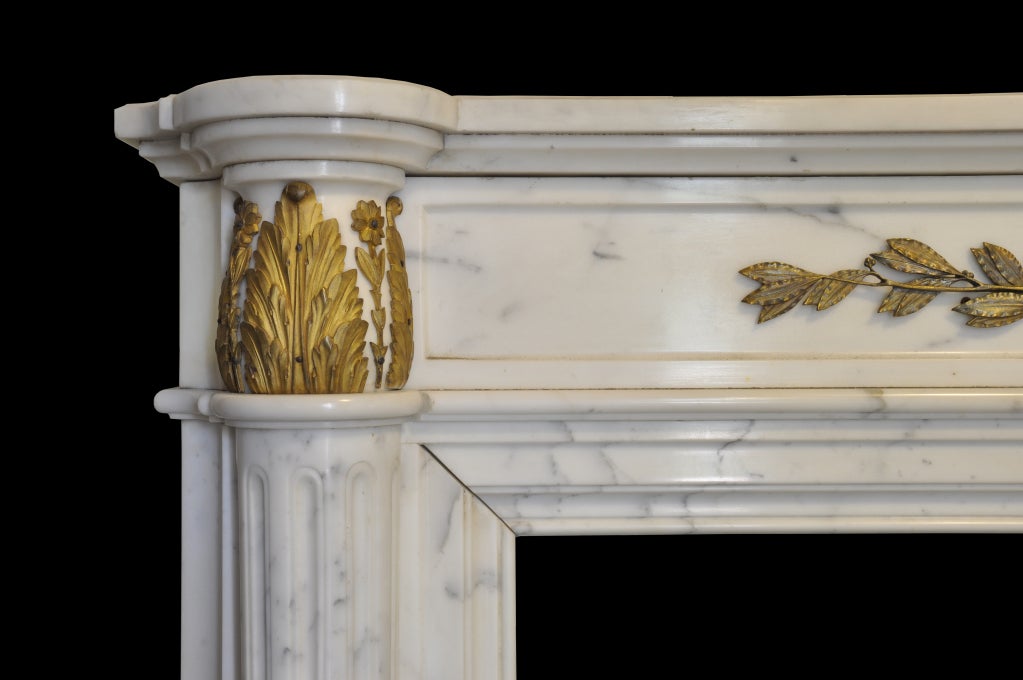 19th Century French Louis the 16th style white marble and gilded bronze fireplace - 19th C.